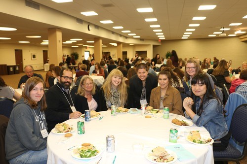 A group enjoying dinner at the Michigan Writing Centers Association